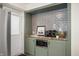 Stylish butler's pantry with a built-in microwave and wine rack, great for entertaining at 3764 E Glenwood Dr, Martinsville, IN 46151