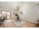 Bright dining room with modern chandelier and a wall of windows that let in lots of light at 3764 E Glenwood Dr, Martinsville, IN 46151