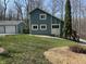 Two story home featuring unique architecture, bright white windows, and charming blue siding at 3764 E Glenwood Dr, Martinsville, IN 46151