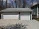 Spacious two-car garage with white doors and light green trim, offering ample parking and storage at 3764 E Glenwood Dr, Martinsville, IN 46151