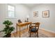 Bright office space with hardwood floors, a window, a desk, and a chair at 3764 E Glenwood Dr, Martinsville, IN 46151