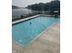 Community pool with crystal clear water, ideal for relaxing and enjoying sunny days with a picturesque lake view at 3764 E Glenwood Dr, Martinsville, IN 46151