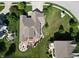 Aerial view of a home showing its backyard patio with a fire pit and seating area, and the surrounding landscape at 3789 Shady Pointe Row, Greenwood, IN 46143