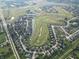 Panoramic aerial view of a community with winding roads and a lush golf course at 3789 Shady Pointe Row, Greenwood, IN 46143