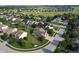 A beautiful aerial view of a lovely neighborhood, with lush green landscaping and a golf course in the background at 3789 Shady Pointe Row, Greenwood, IN 46143