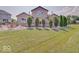Sprawling backyard features mature trees, a fire pit, and a lovely grassy lawn at 3789 Shady Pointe Row, Greenwood, IN 46143