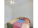 Bright bedroom with ceiling fan and a colorful quilt on the bed at 3789 Shady Pointe Row, Greenwood, IN 46143