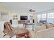 Spacious living room with large windows, comfortable seating, and entertainment center at 3789 Shady Pointe Row, Greenwood, IN 46143