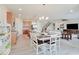 Open floor plan showcasing the kitchen, dining area, and living room with plenty of natural light at 3789 Shady Pointe Row, Greenwood, IN 46143