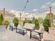 Relaxing outdoor patio with cushioned seating, brick columns, and overhead string lights at 3789 Shady Pointe Row, Greenwood, IN 46143