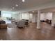 Open basement living space with luxury vinyl floors, seating area, and dining area at 415 N Westview Dr, Columbus, IN 47201