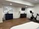 Finished basement featuring a home gym with exercise bike and entertainment area at 415 N Westview Dr, Columbus, IN 47201