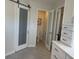 Well-lit bathroom with a sliding glass door, a toilet, and vanity, designed for both style and functionality at 415 N Westview Dr, Columbus, IN 47201