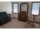 Bedroom features a baby bed, dresser with mirror, and rocking chair at 415 N Westview Dr, Columbus, IN 47201