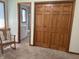 Spacious bedroom boasts wooden closet doors with an attached bathroom at 415 N Westview Dr, Columbus, IN 47201