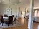 Elegant dining room featuring a round table with seating for six and views of the adjacent living room at 415 N Westview Dr, Columbus, IN 47201