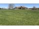 Beautifully landscaped home situated on a hill with a well-manicured lawn at 415 N Westview Dr, Columbus, IN 47201