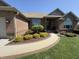Attractive brick home featuring a stone walkway and well-maintained landscaping with flowering bushes at 415 N Westview Dr, Columbus, IN 47201