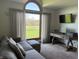 Comfortable living room featuring a large arched window with backyard views at 415 N Westview Dr, Columbus, IN 47201