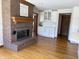 Inviting living room showcases a brick fireplace and built-in white cabinetry at 415 N Westview Dr, Columbus, IN 47201