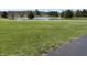 Expansive lawn and tranquil pond in a picturesque community at 415 N Westview Dr, Columbus, IN 47201