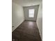 This is a bedroom with wood floors and a window at 4506 Phoenix Dr, Indianapolis, IN 46241