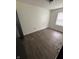 This is a bedroom with wood floors and a window at 4506 Phoenix Dr, Indianapolis, IN 46241