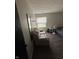 Bedroom featuring hardwood floors, a window, and comfortable seating at 4506 Phoenix Dr, Indianapolis, IN 46241