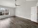 Spacious bedroom with high ceilings, hardwood floors, and a large window for plenty of sunlight at 4630 Kelvington Dr, Indianapolis, IN 46254