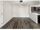 Dining area with hardwood floors and modern lighting adjacent to the kitchen, great for entertaining at 4630 Kelvington Dr, Indianapolis, IN 46254