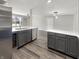 Bright kitchen with modern cabinetry, stainless appliances, and an adjacent breakfast bar at 4630 Kelvington Dr, Indianapolis, IN 46254