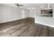 Bright and spacious living room with a sleek breakfast bar and vinyl plank flooring at 4630 Kelvington Dr, Indianapolis, IN 46254