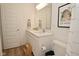 Bright bathroom featuring a double vanity sink, wood floors and a toilet at 5181 Golden Grove Dr, McCordsville, IN 46055