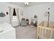 Charming Bedroom decorated with nautical-themed wall decor, modern ceiling fan and plush carpeting at 5181 Golden Grove Dr, McCordsville, IN 46055