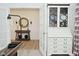 Bright entryway with a console table, round mirror and wood-look floors at 5181 Golden Grove Dr, McCordsville, IN 46055