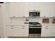 Updated kitchen featuring white cabinets, stainless steel appliances and light countertops at 5181 Golden Grove Dr, McCordsville, IN 46055