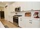 Modern kitchen featuring white cabinetry, stainless steel appliances, and granite counter tops at 5181 Golden Grove Dr, McCordsville, IN 46055