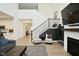 Open concept living room showcases a fireplace and views into the entry at 5181 Golden Grove Dr, McCordsville, IN 46055