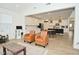 Open-concept living room and kitchen featuring modern finishes and light wood flooring at 5181 Golden Grove Dr, McCordsville, IN 46055