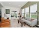 Open concept living room with access to the patio, large windows, and vaulted ceilings at 5181 Golden Grove Dr, McCordsville, IN 46055