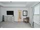 Spacious main bedroom featuring a ceiling fan and tray ceiling, large windows, and neutral decor at 5181 Golden Grove Dr, McCordsville, IN 46055