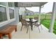 Covered patio with outdoor dining set and string lights overlooks the manicured backyard at 5181 Golden Grove Dr, McCordsville, IN 46055