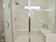 Bright bathroom featuring a large shower with marble floors and bench seating at 5181 Golden Grove Dr, McCordsville, IN 46055