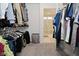 Spacious walk-in closet with shelving leads to a bright bathroom with glass-enclosed shower at 5181 Golden Grove Dr, McCordsville, IN 46055