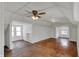 Bright attic with hardwood floors, built-in bookshelves, and ample windows at 52 N Oakland Ave, Indianapolis, IN 46201
