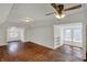 Attic featuring hardwood floors, built-in shelves, and natural light at 52 N Oakland Ave, Indianapolis, IN 46201
