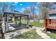 Beautiful backyard with a gazebo, concrete patio, and well-maintained lawn at 52 N Oakland Ave, Indianapolis, IN 46201