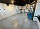 Unfinished basement with painted floor, washing machine, and utility systems at 52 N Oakland Ave, Indianapolis, IN 46201