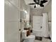 Bathroom with vanity, tub, and tiled walls at 52 N Oakland Ave, Indianapolis, IN 46201