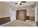 Bedroom boasting natural light, ceiling fan, and closet at 52 N Oakland Ave, Indianapolis, IN 46201